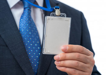 A man showing his id card and lace