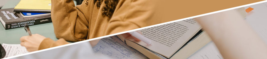 A woman writing on a test paper, person reading a book