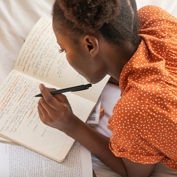 A person reviewing her notes and preparing for an exam