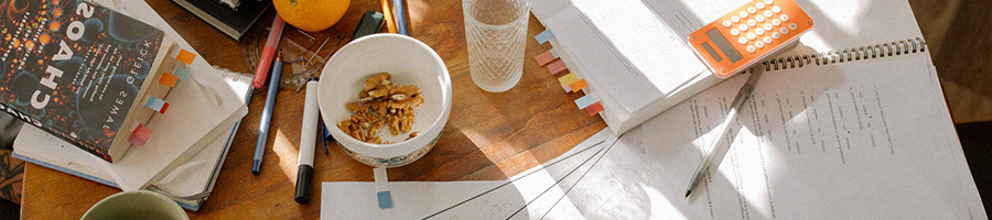 A study table with scattered school related works