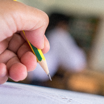 A student holding a pencil