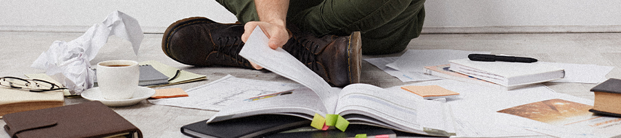 A student looking at different kinds of books