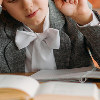 A young girl thinking and reviewing