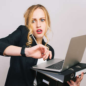 A startled woman looking at her watch