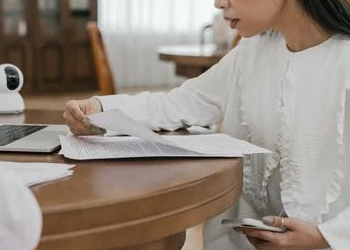 A woman reading an essay