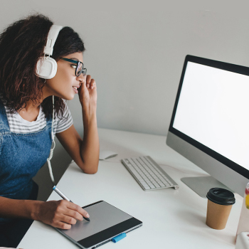 A woman in front of her computer