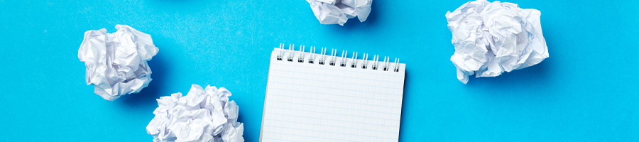 Crumpled papers on a blue background