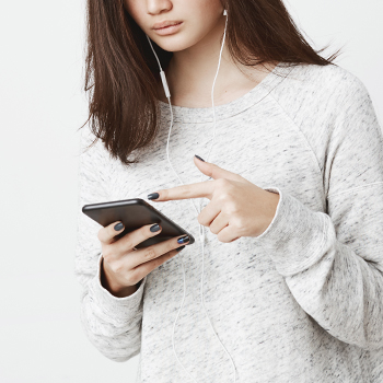 A woman pointing at her phone