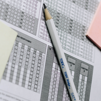 An answer sheet with a white pencil