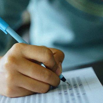 A student shading an answer sheet