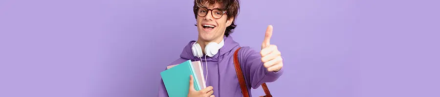 Boy student holding up a thumbs up