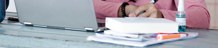 A woman studying from home using her laptop