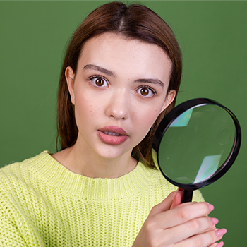 A person with magnifying glass