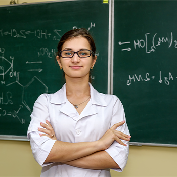 woman standing infront of a blackboard