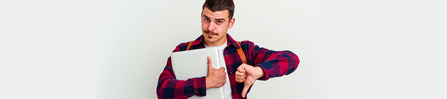 man holding up paper and thumbs up and down