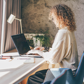 woman using her laptop on desk