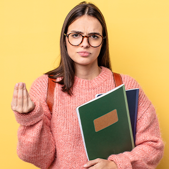 student holding books