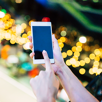 hand view of a person using a phone