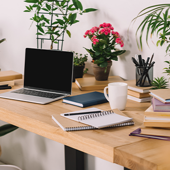 table with books and a laptop