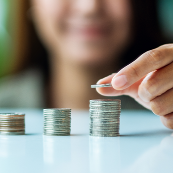 hand view of a woman counting coins