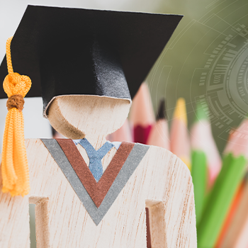 wooden toy with a small mortarboard hat