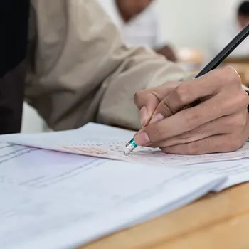 person working on his test paper