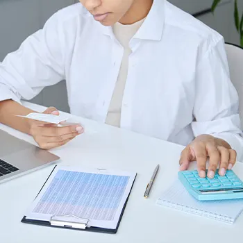 man using a calculator