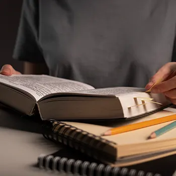 person reading and taking notes