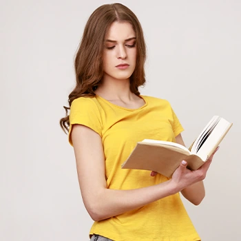 woman looking at a book