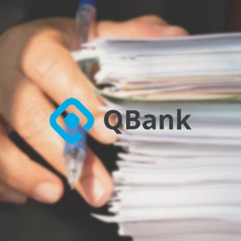 stack of paper with Qbank logo