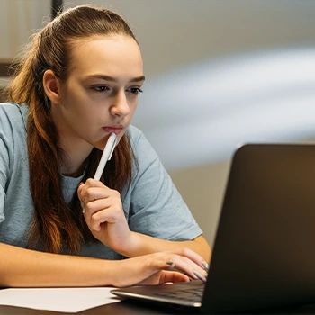 female student using laptop